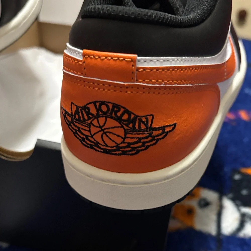 Jordan Men's Black and Orange Low-Top Sneakers